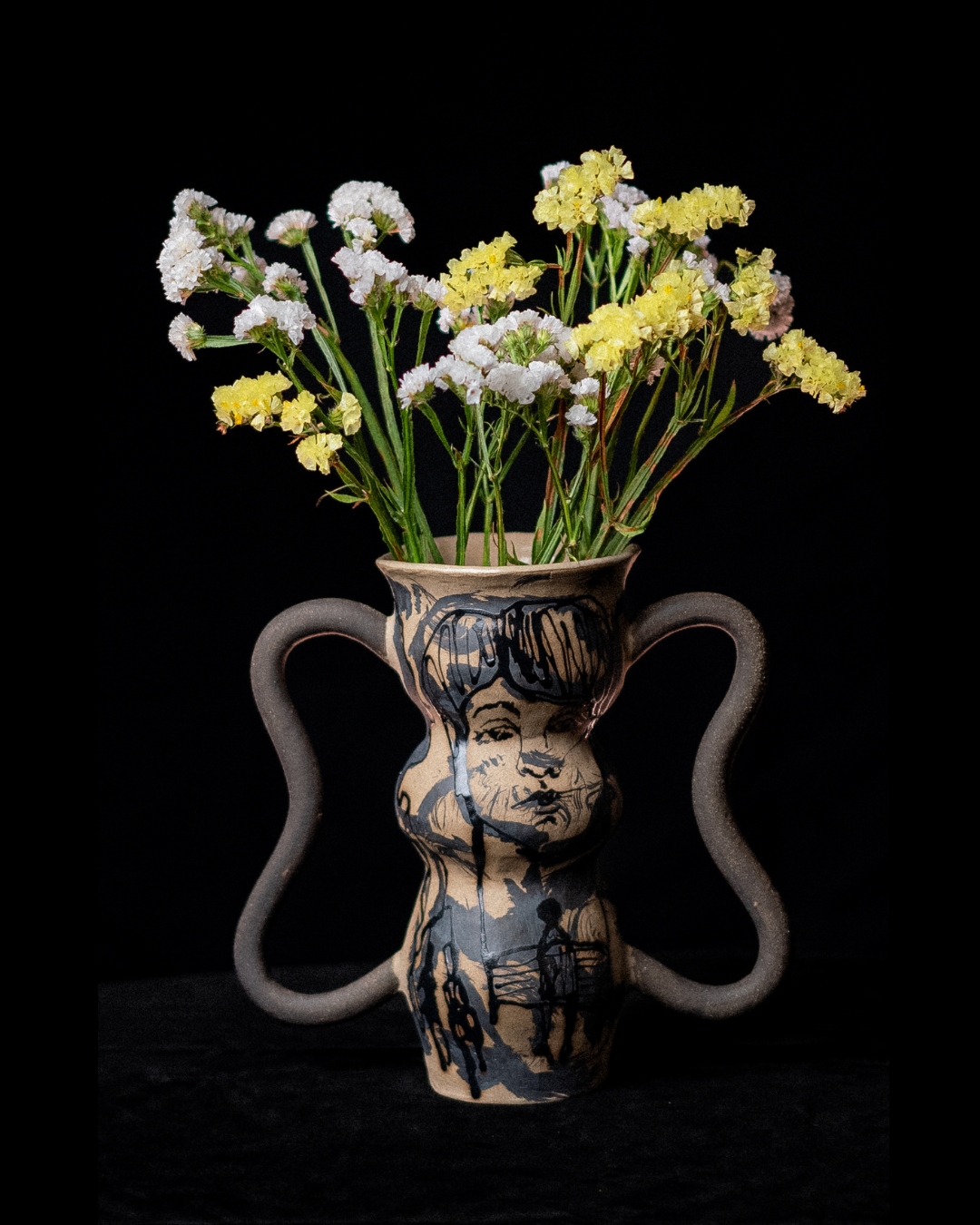 Ceramic vessel highlighting illustrated linework, marbled ceramic glazes and handcrafted surface textures.