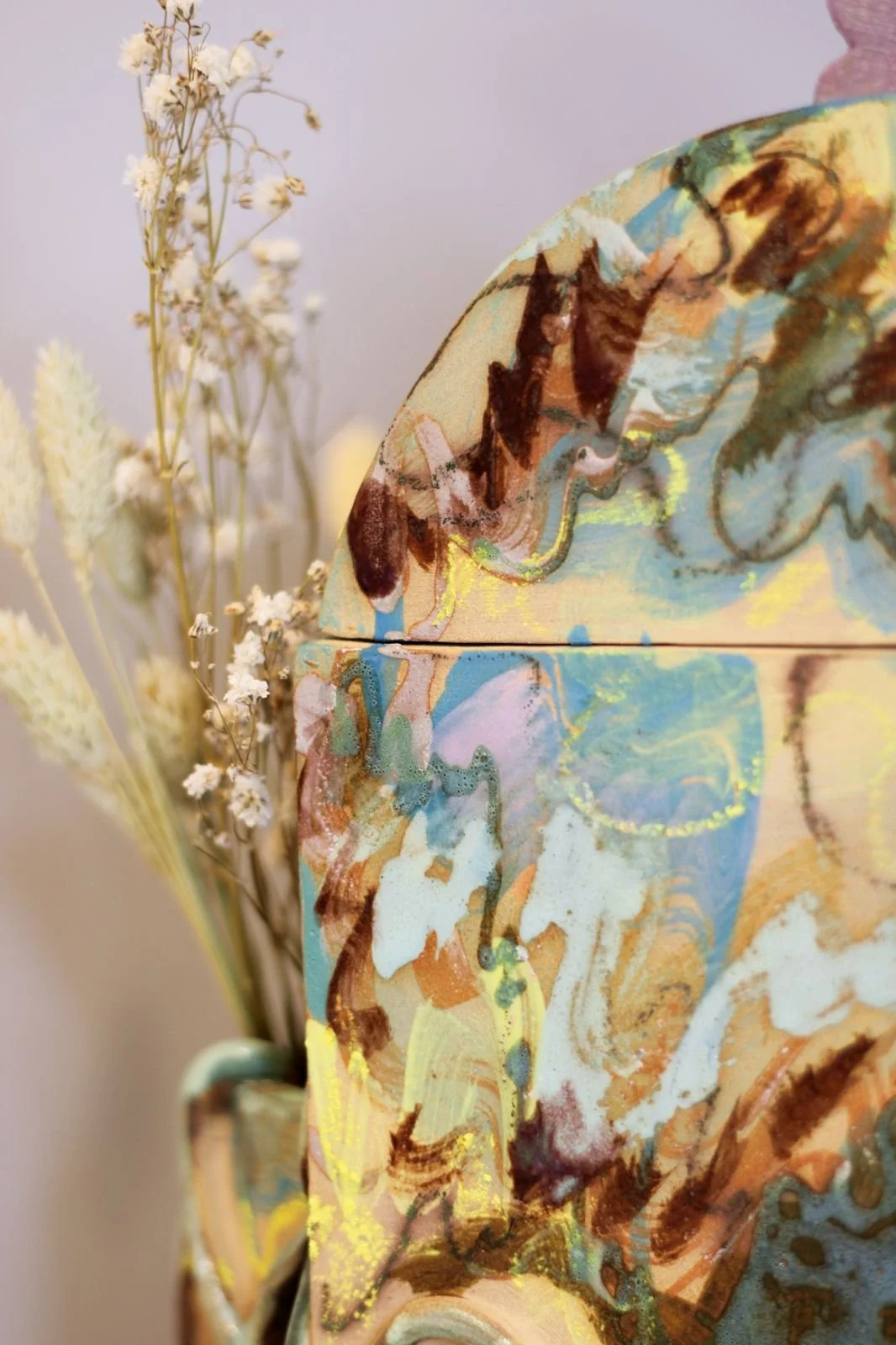 Detail of hand-built memorial ceramic urn commissioned by a private collector, featuring a custom colour palette and an integrated space for fresh flowers.