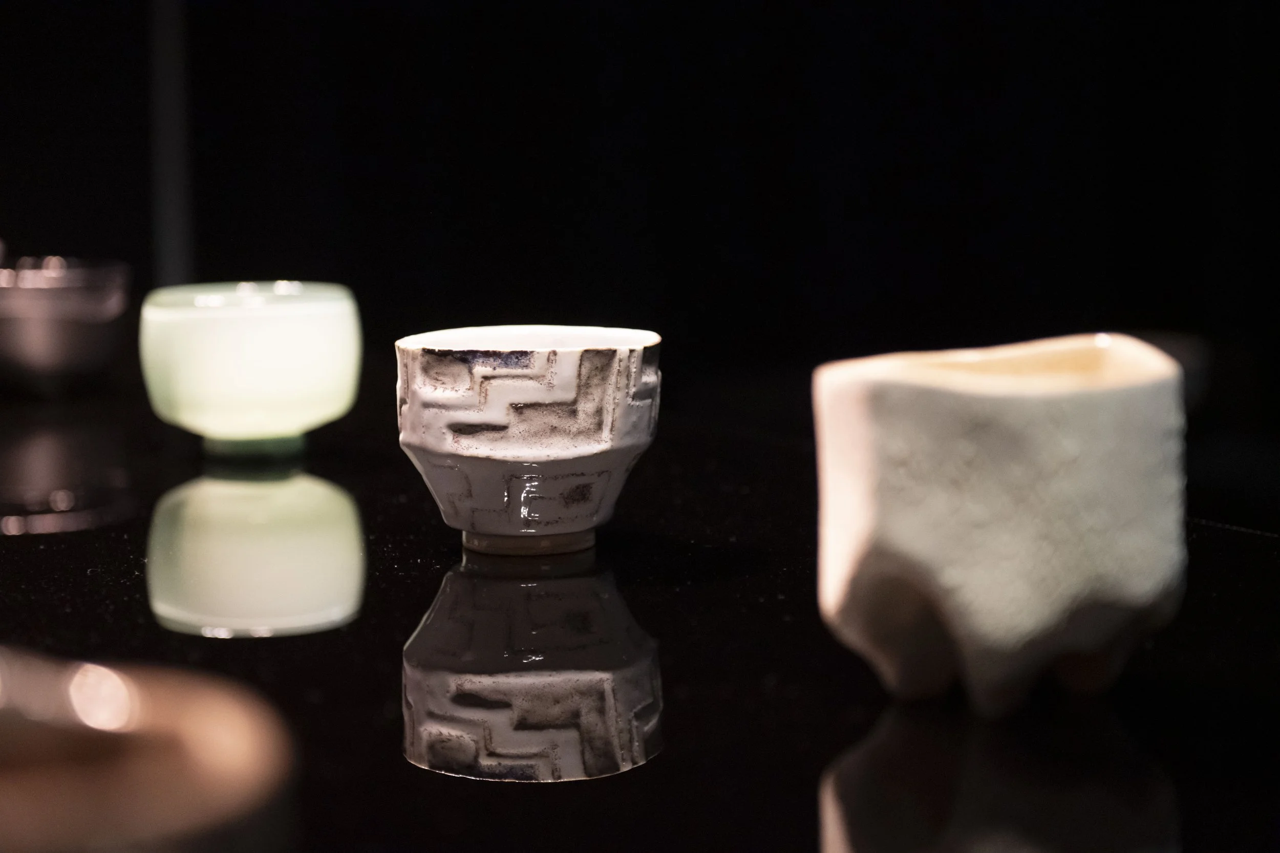 Photography featuring Valeria R.O.'s hand-built ceremonial ceramic cup with kené-inspired textures exhibited during NYCxDESIGN group exhibition.