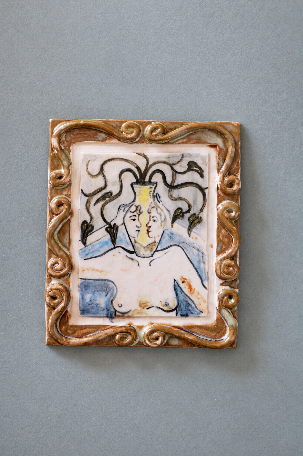 Hand-built ceramic wall piece featuring illustrated botanical forms, flowing linework and layered ceramic glazes.