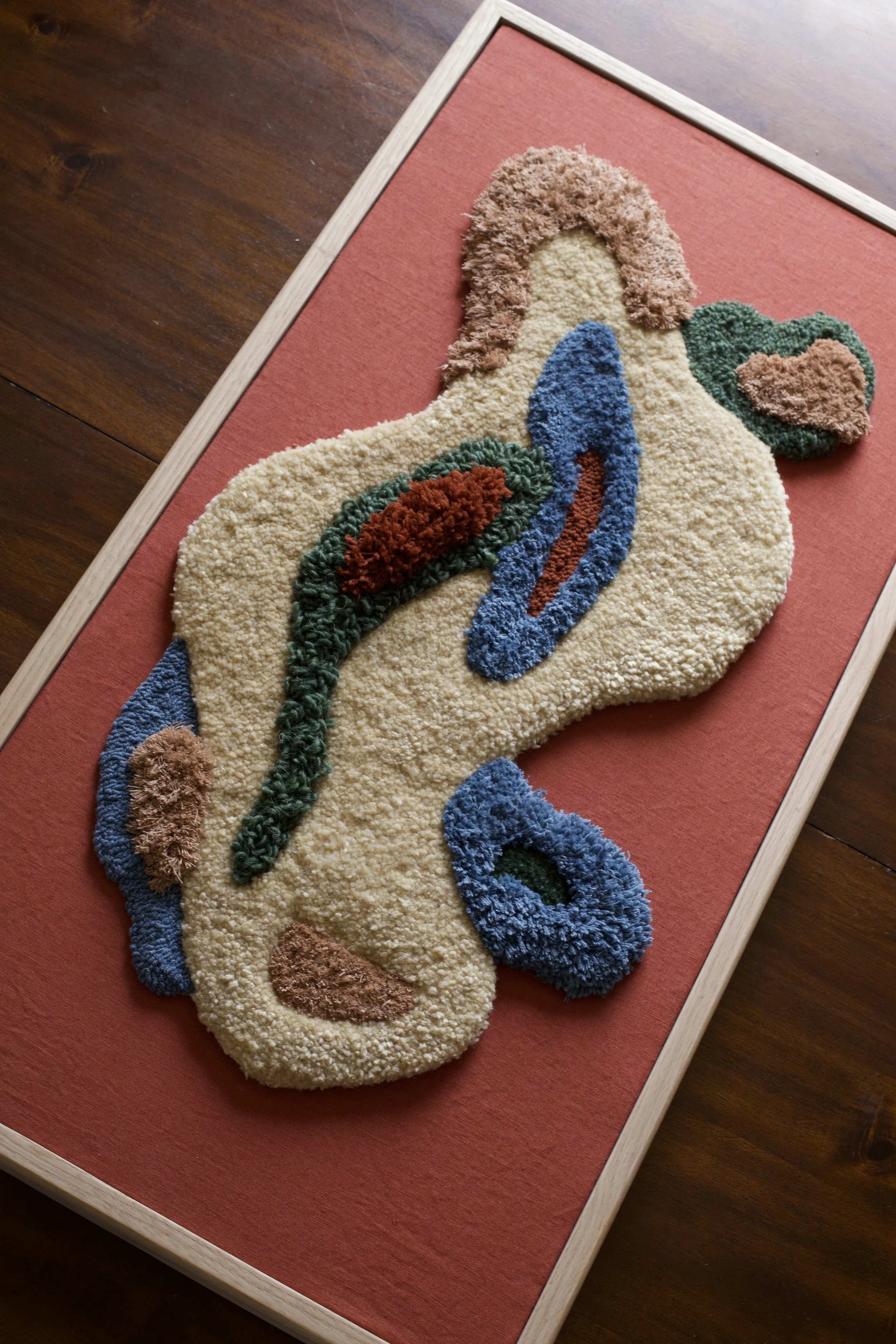 Kaya (Home) 2025
Textile art designed to help make your house a home. I made this with the hope that it reminds you: you belong, you are safe, you are home.
Abstract fibre art. made from linen, wool and cotton. the frame is made from oak. it measures