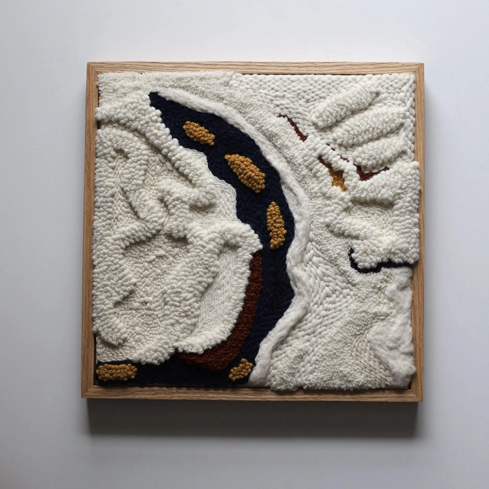 Rooted
Deep navy, ivory and warm amber  the colours of steady strength. Warm, bold, and completely sure of itself.
