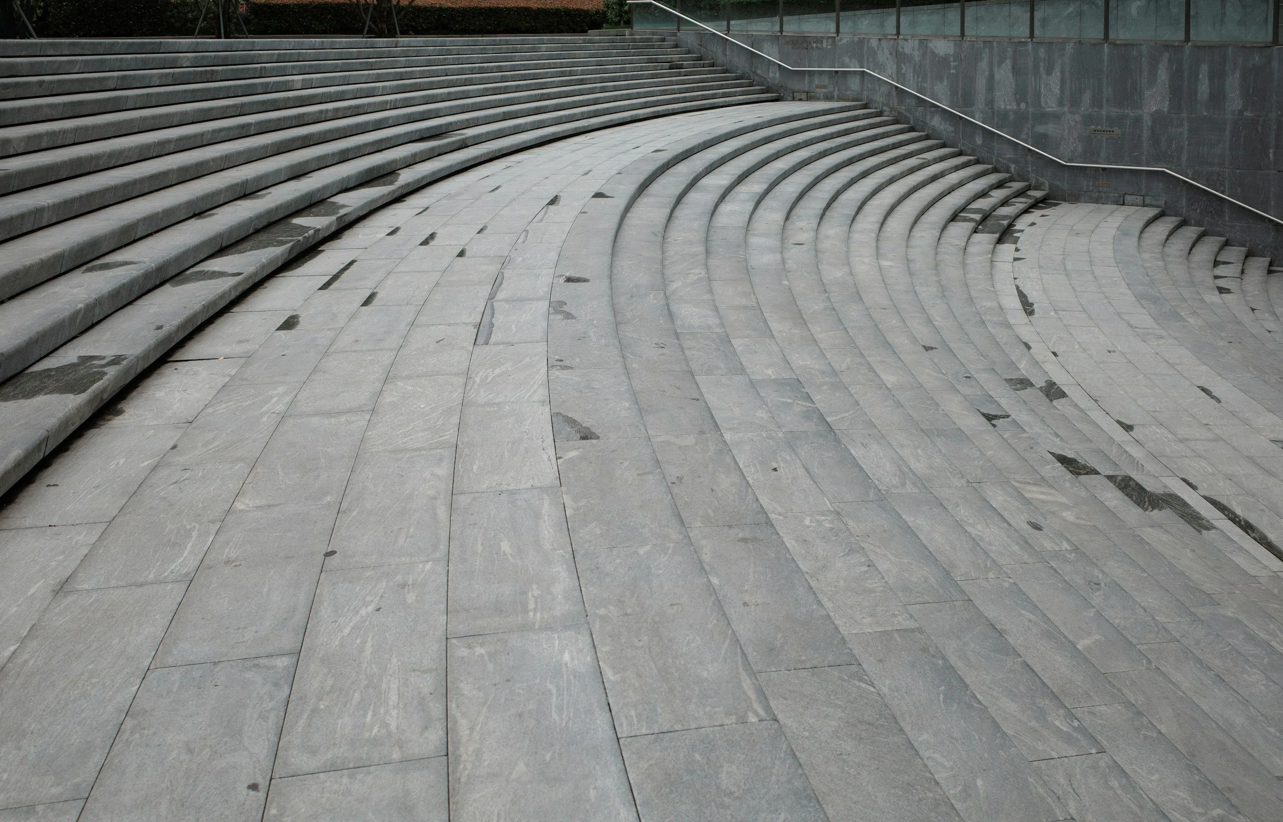 large set of crescent shaped stairs wet after a pressure washing cleaning