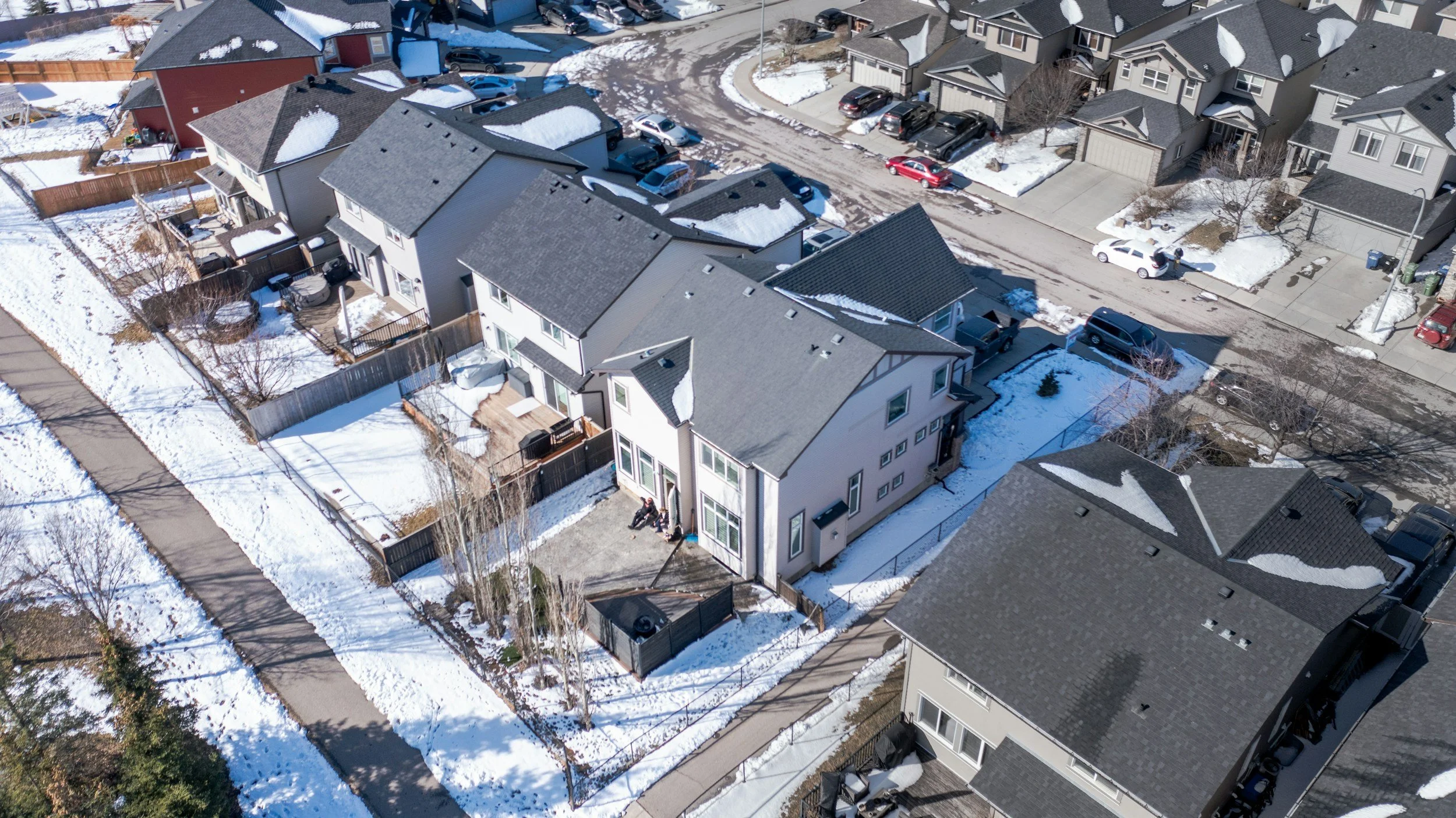 Aerial photo of quality Star Idaho track homes covered in snow with freshly shoveled walkways and streets