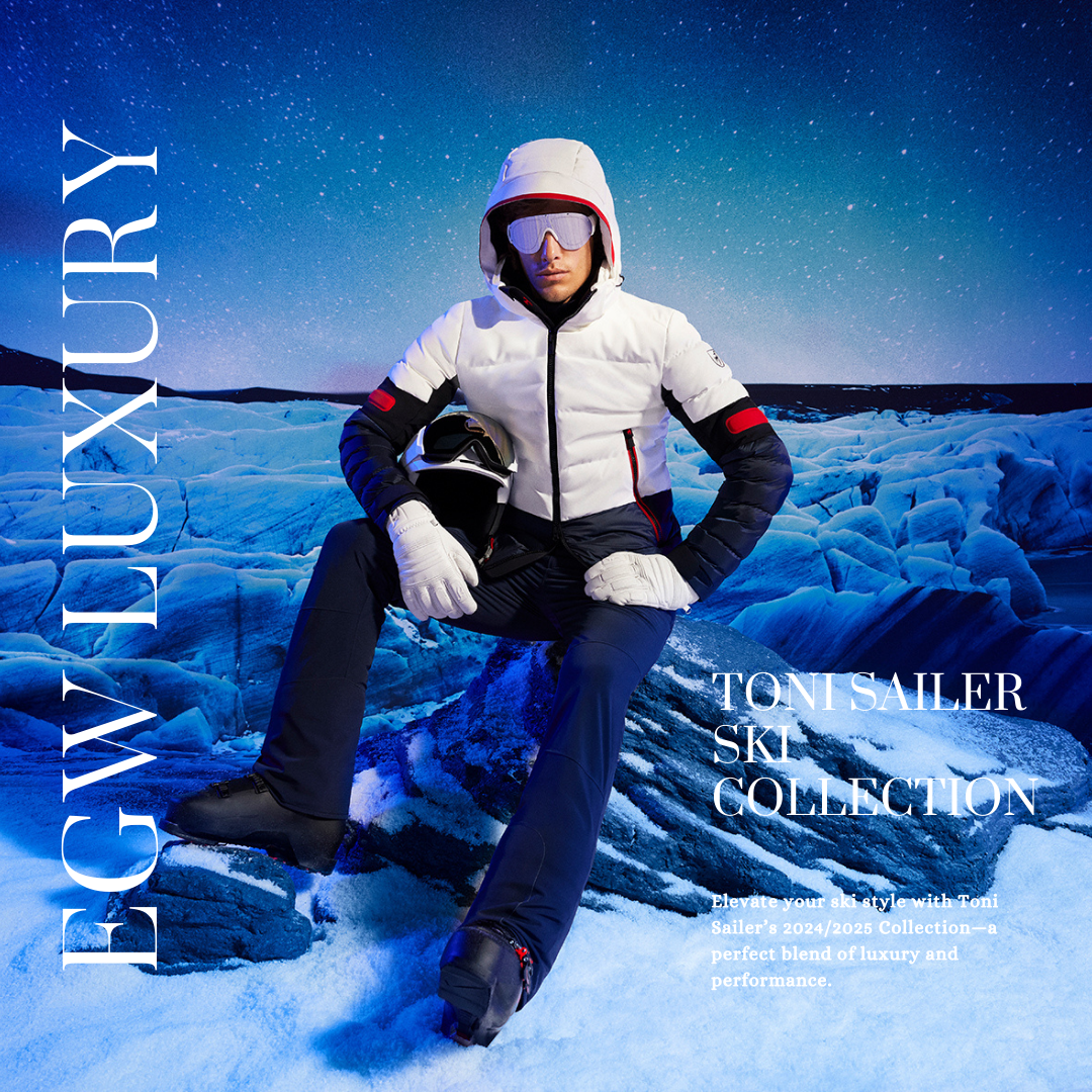 A woman in winter ski gear sitting on ice, holding a helmet, with a snowy landscape and starry night sky in the background. Text overlay promotes the Toni Sailer ski collection.