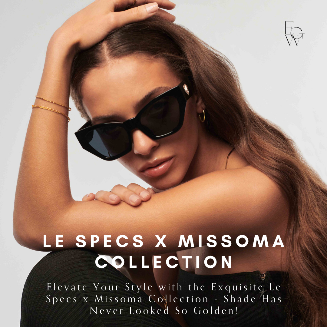 Luxury fashion advertisement featuring a woman with long brown hair wearing oversized black sunglasses, gold hoop earrings, a gold bracelet, and a black strapless top, against a plain white background.