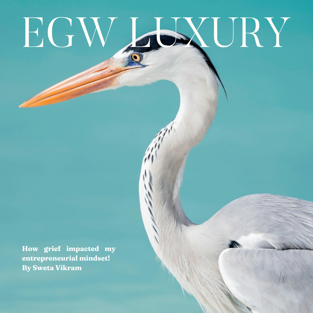 Close-up of a heron against a blue background with the text 'EGW LUXURY' at the top and a subtitle 'How grief impacted my entrepreneurial mindset! By Sweta Vikram'.