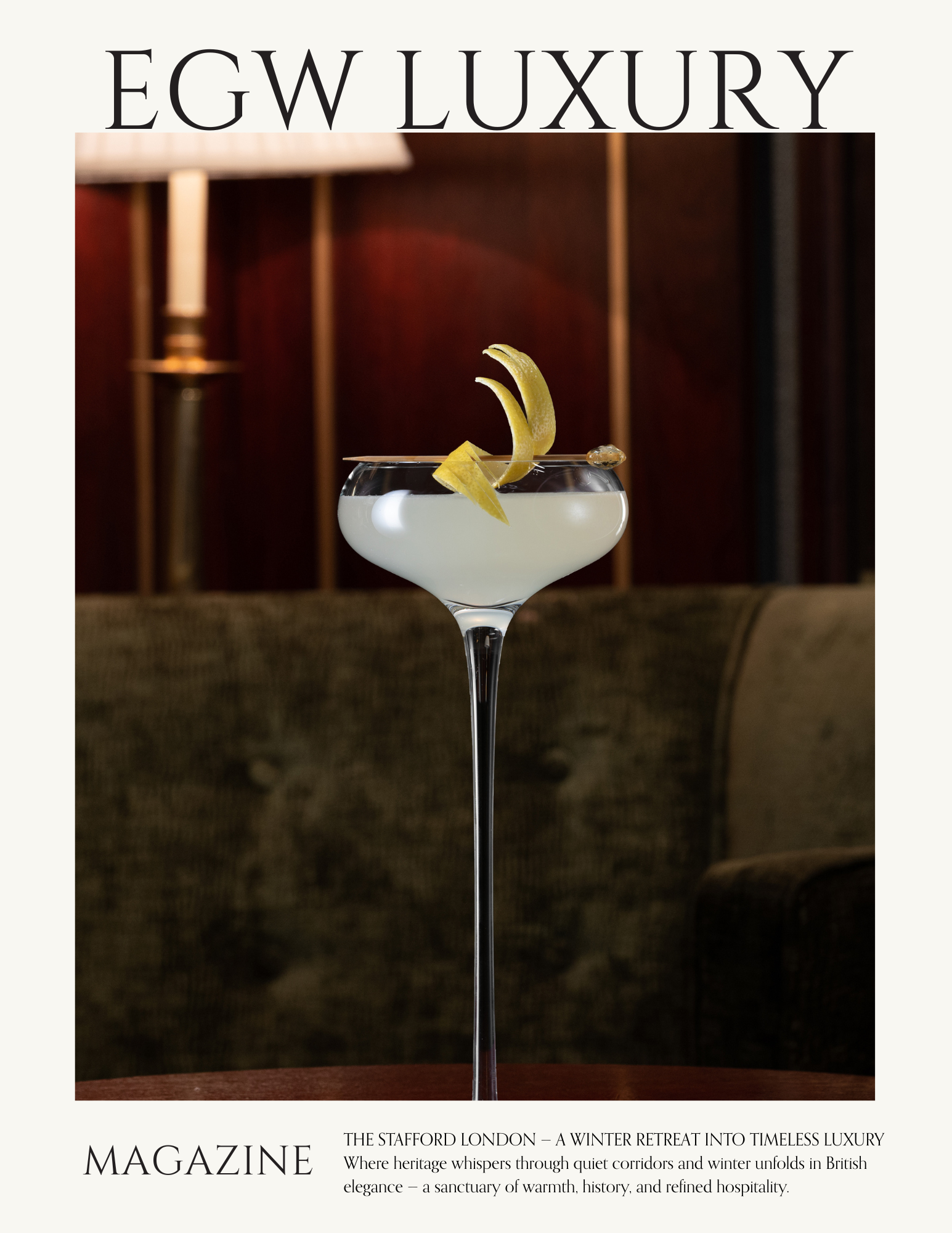 Cover of a luxury magazine featuring a cocktail glass with a lemon twist garnish, positioned on a wooden surface with a blurred background of warm lighting and dark wood paneling.