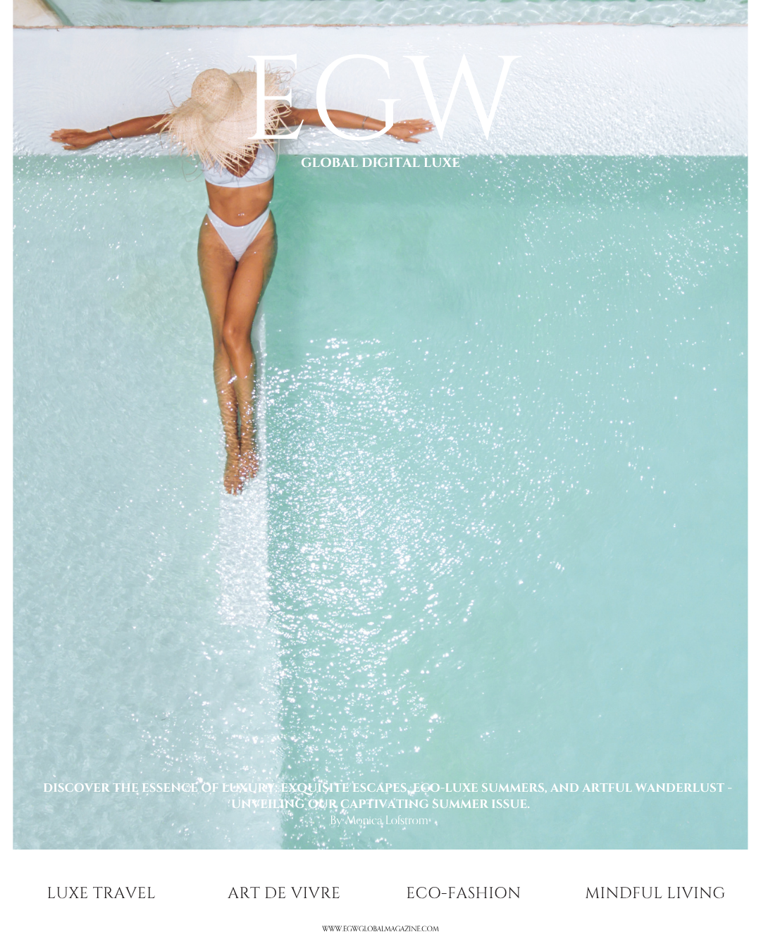 A woman in a white bikini and a large straw hat, holding arms outstretched, standing at the edge of a swimming pool with water splashing around her.