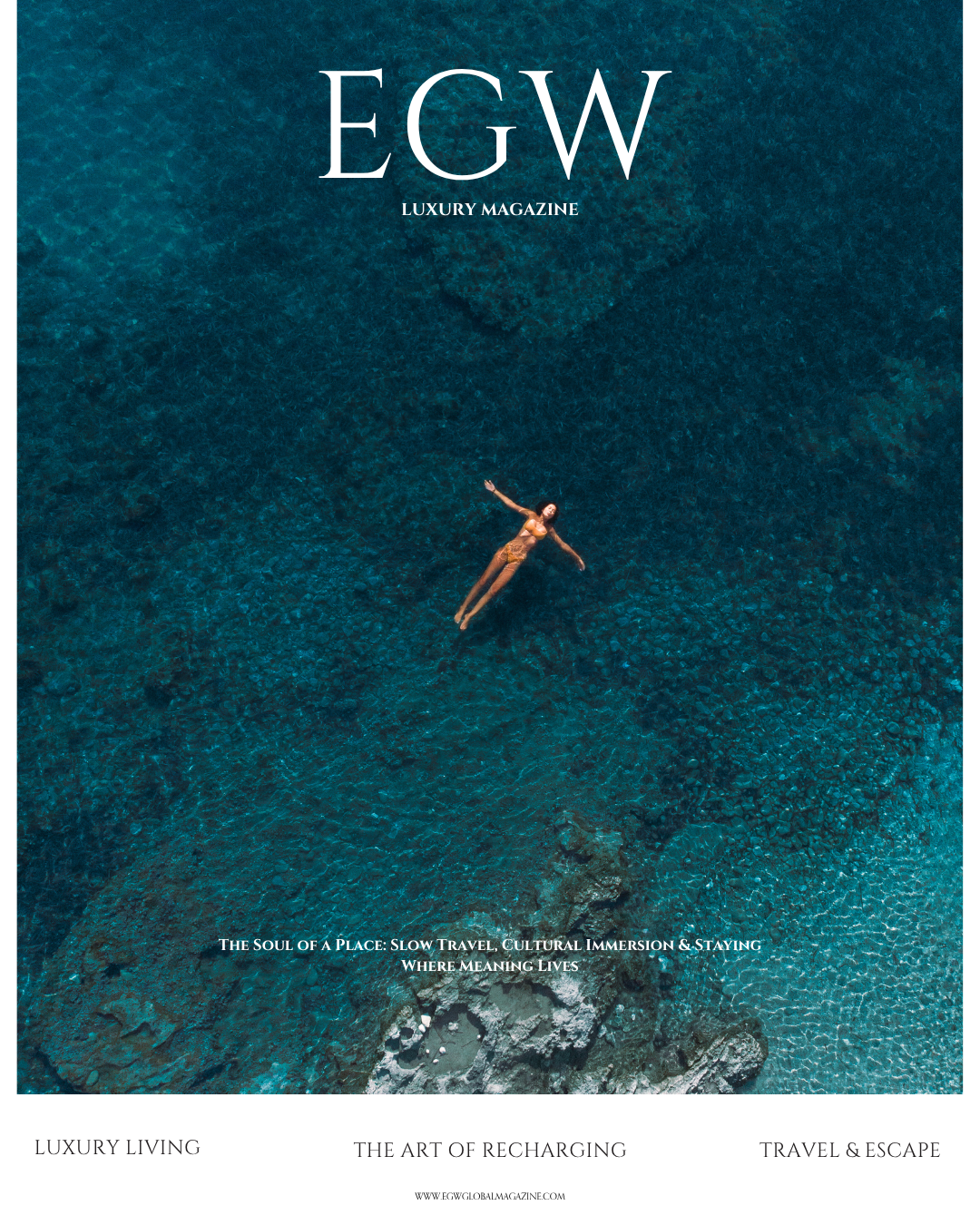 Cover of EGW Luxury Magazine featuring an aerial view of a woman floating in clear blue water near rocks.