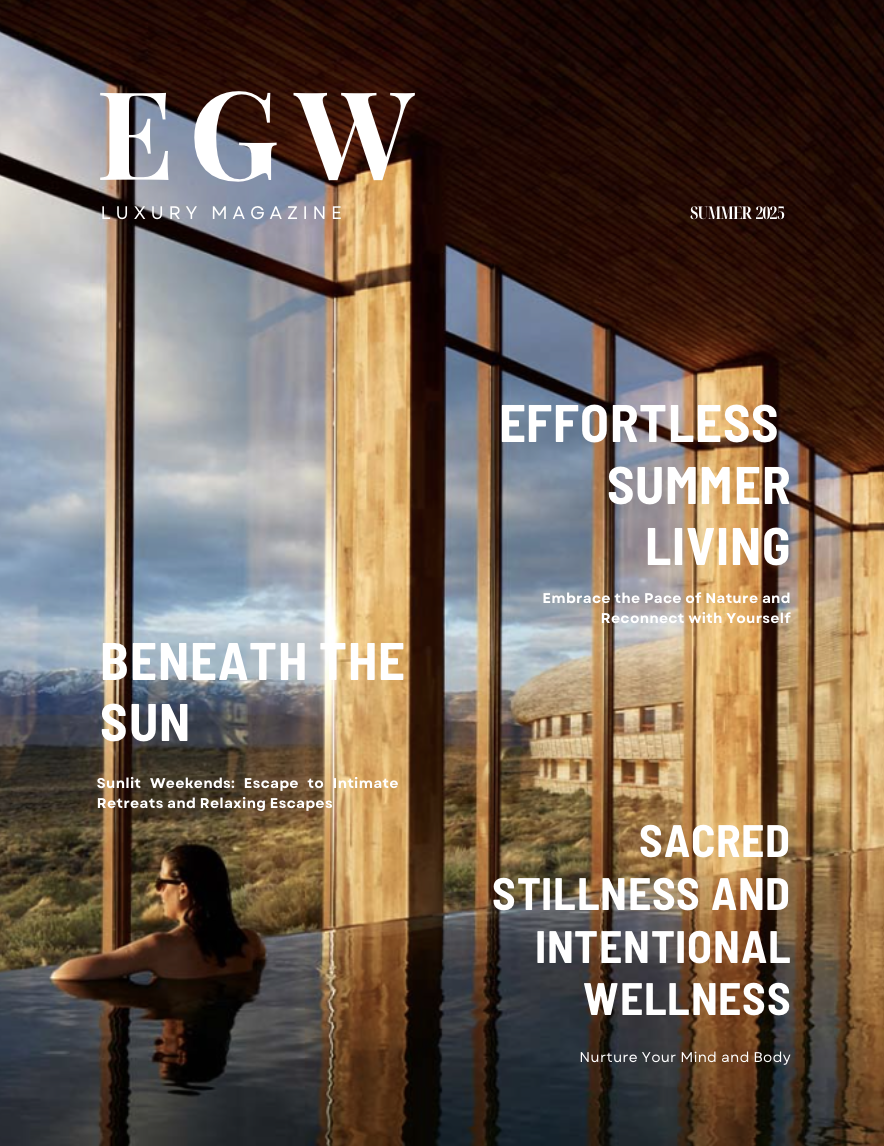 Cover of luxury magazine 'EGW' Summer 2025 featuring a woman relaxing in an indoor pool with floor-to-ceiling windows overlooking a natural landscape with mountains in the background.