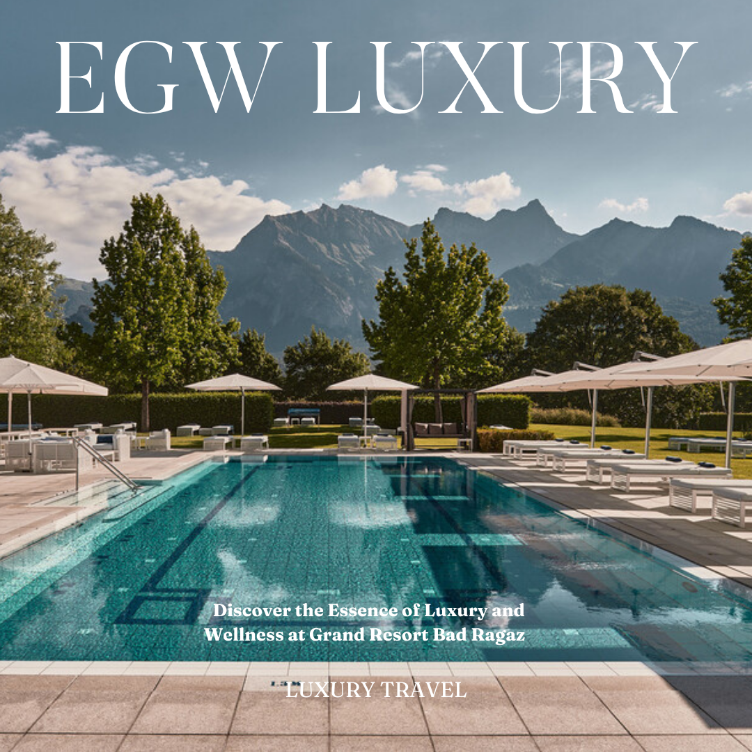 A luxurious outdoor swimming pool with chairs and umbrellas, set against a backdrop of trees and mountains, promoting a luxury travel experience at Grand Resort Bad Ragaz.