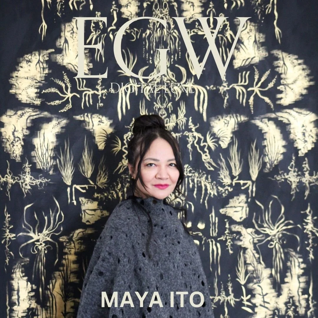 A woman standing in front of a black and gold artistic background with the text 'ECW' and 'Digital' at the top and 'Maya Ito' at the bottom. She has dark hair tied up, wearing a gray, slightly distressed dress.