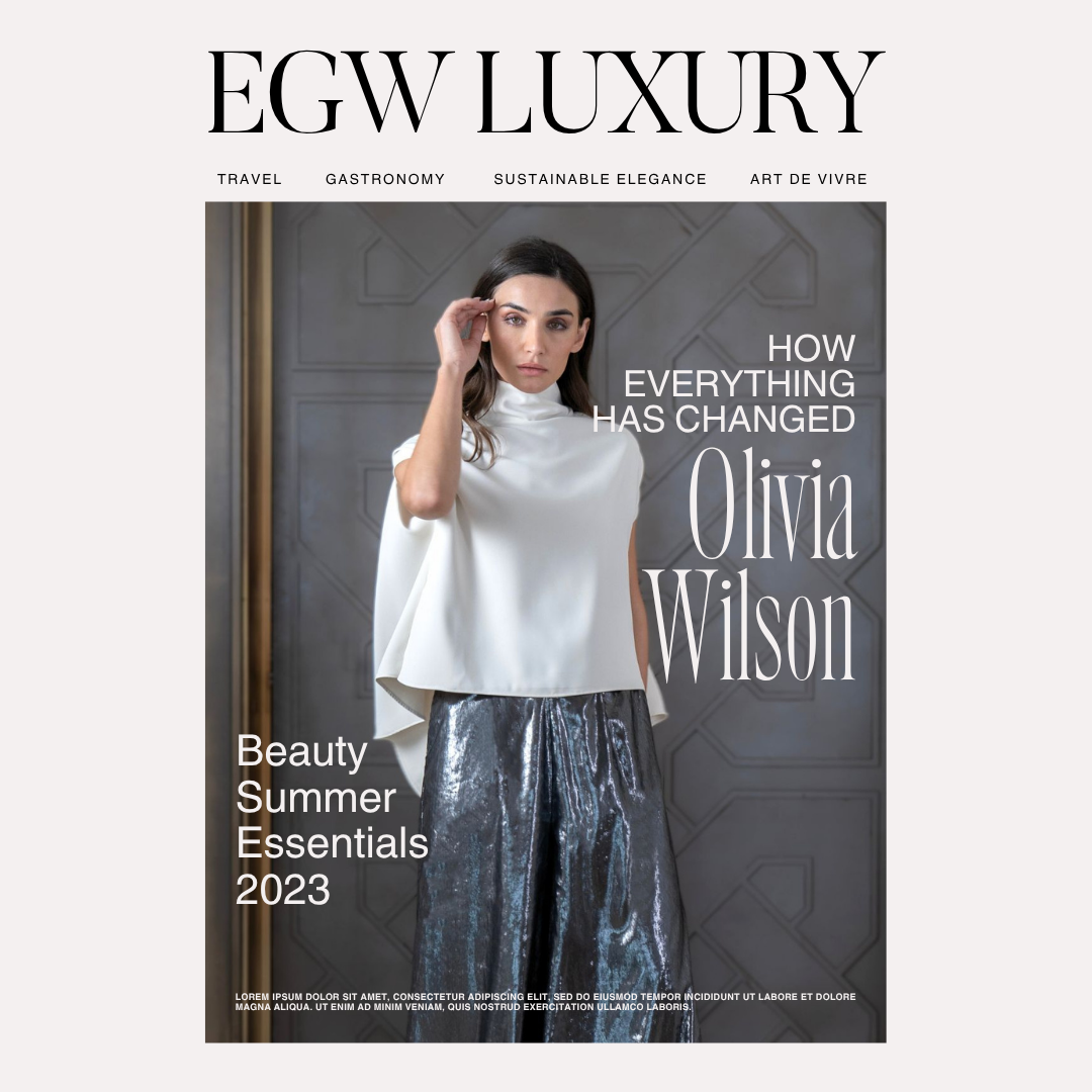 Magazine cover titled "EGW Luxury" featuring a woman in stylish clothing, with headlines about Olivia Wilson, summer essentials, and fashion.