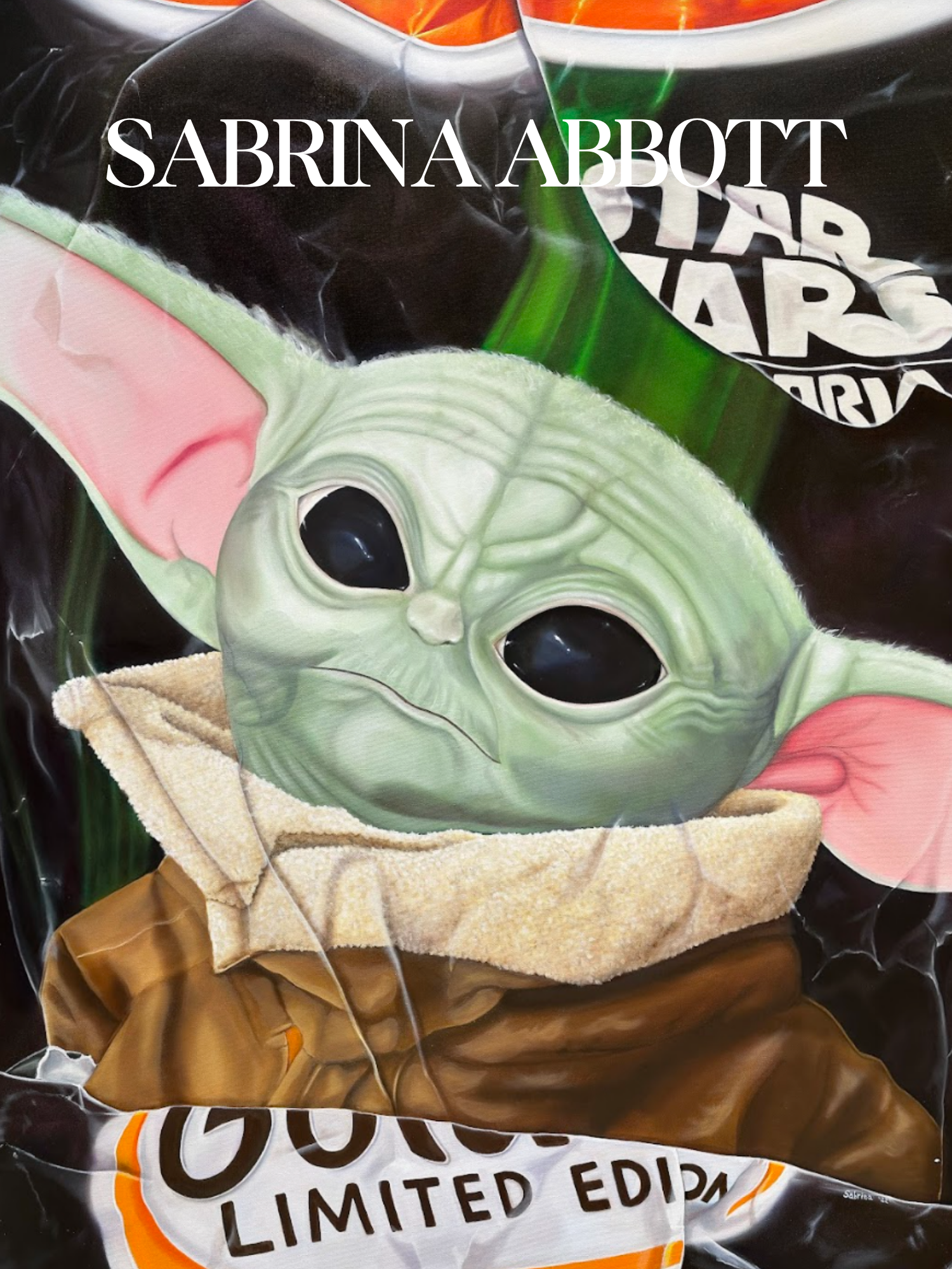 A bag of limited edition Star Wars alien character-themed potato chips with an alien character illustration and a towel underneath it.