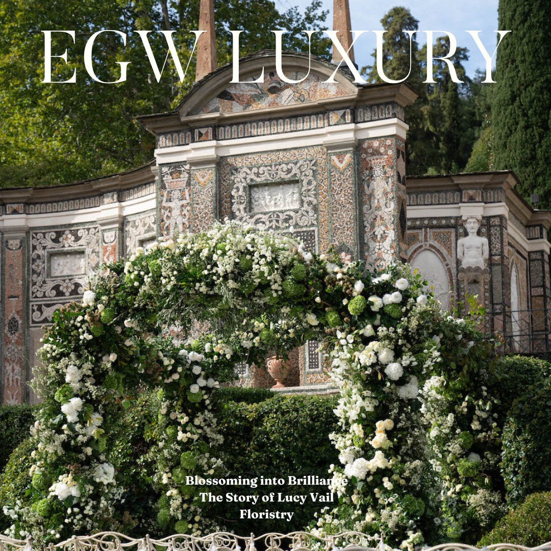 Magazine cover with a floral arch and front of a ornate, historic building.
