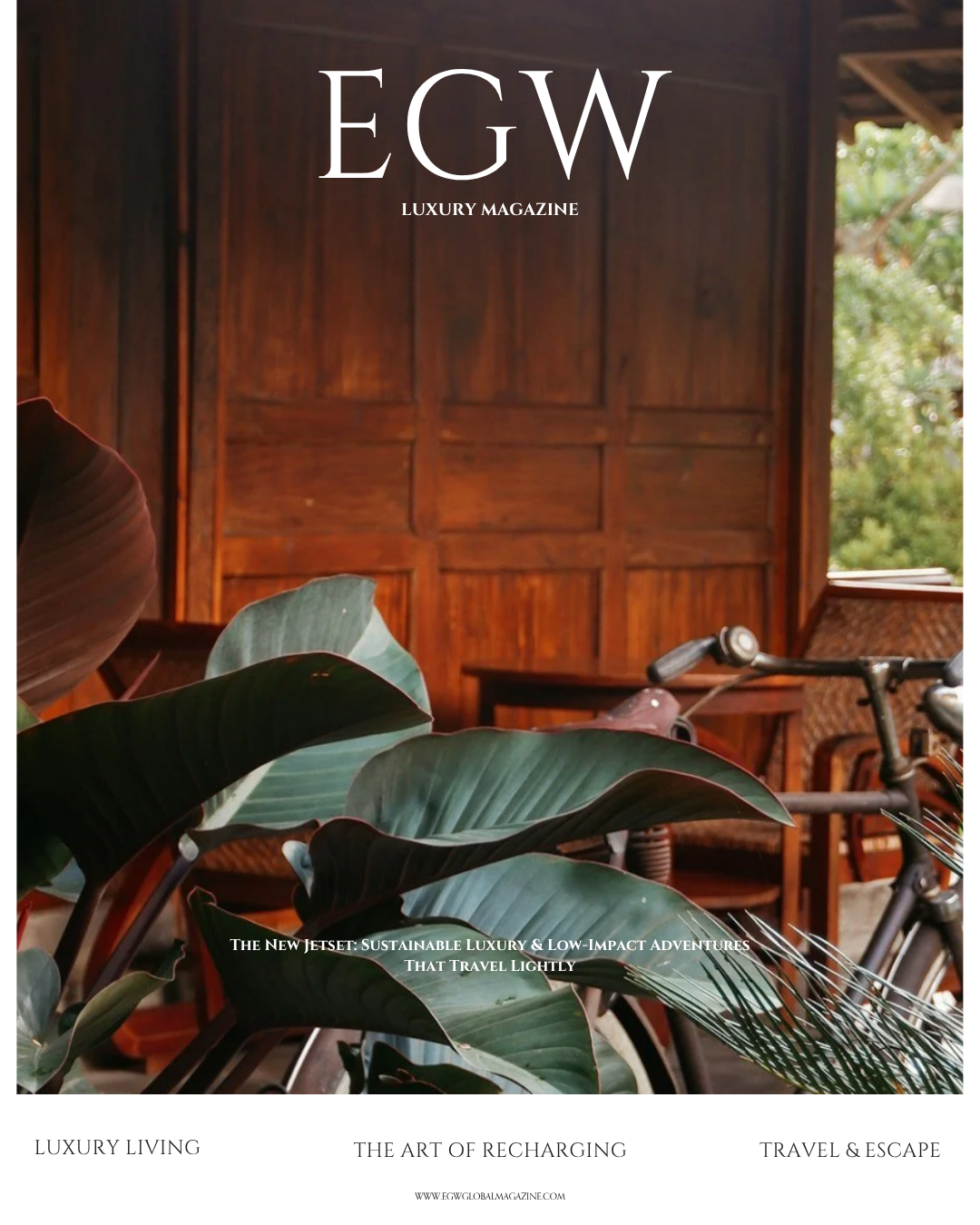 Cover of EGW luxury magazine featuring a tropical interior with large green leaves, wooden walls, and a vintage bicycle.