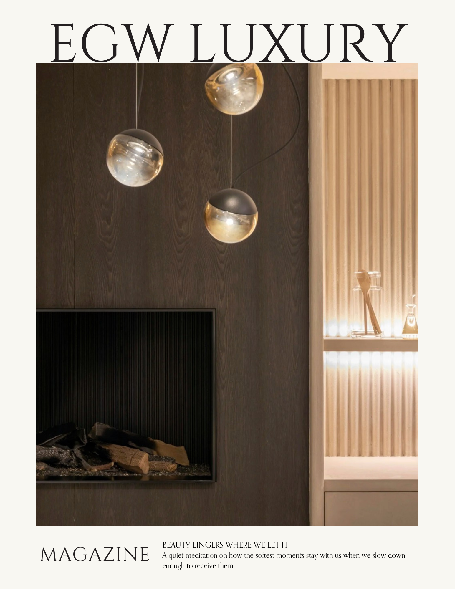 A modern interior design featuring a dark wood wall with suspended glass globe pendant lights above a fireplace with decorative logs, and a beige wood-paneled wall with a glass decanter and glasses on a shelf.