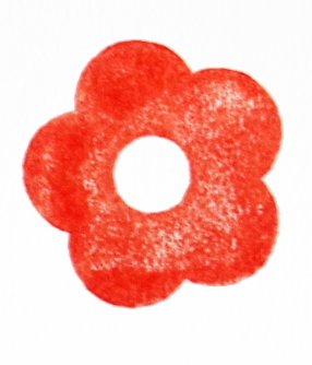 Red flower-shaped stamp with a hole in the center on white paper