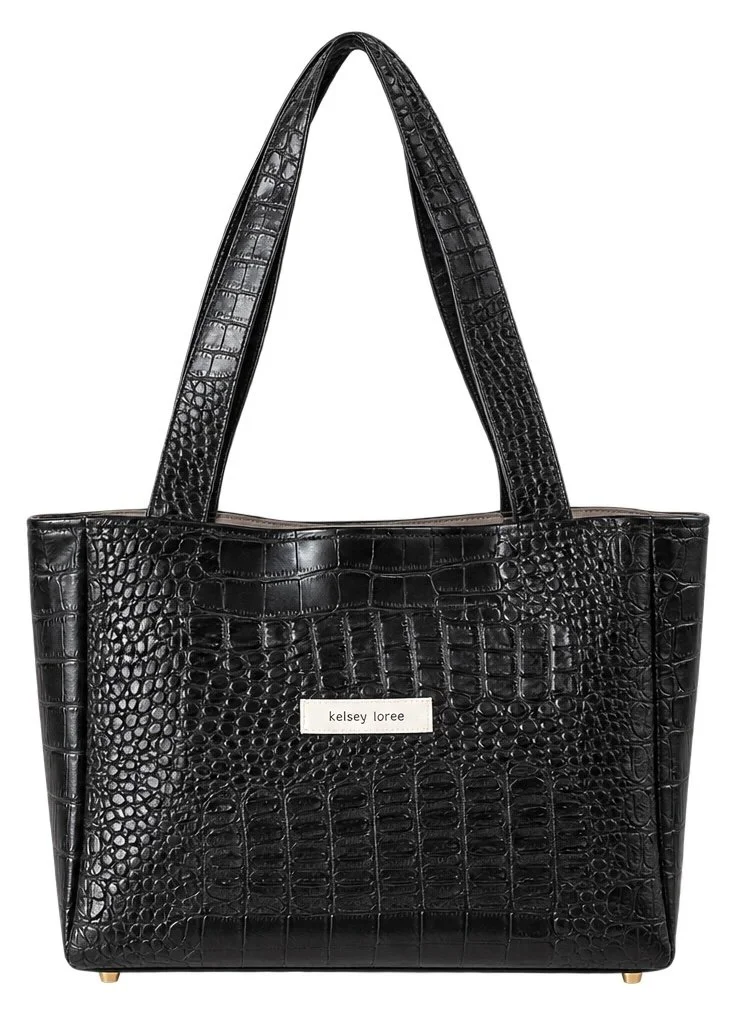 Black faux crocodile leather tote bag with a silver nameplate that reads 'kelsey loree' on the front.