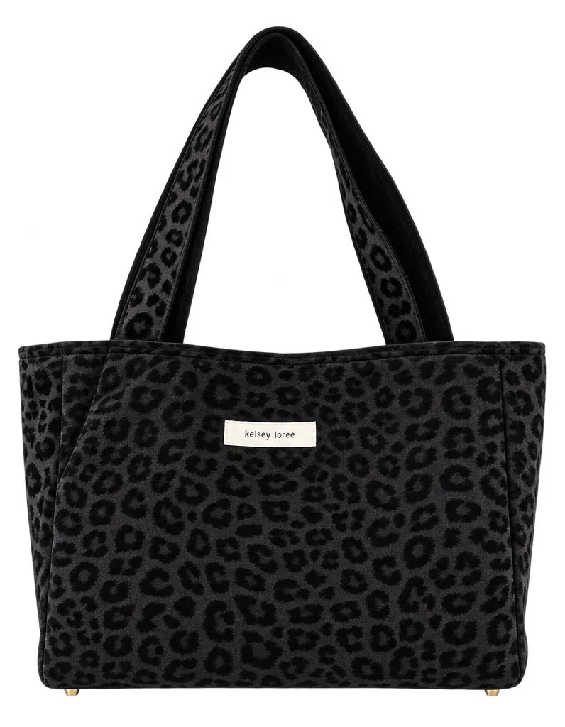 Black tote bag with leopard print pattern and label that reads 'kelsey loree'.