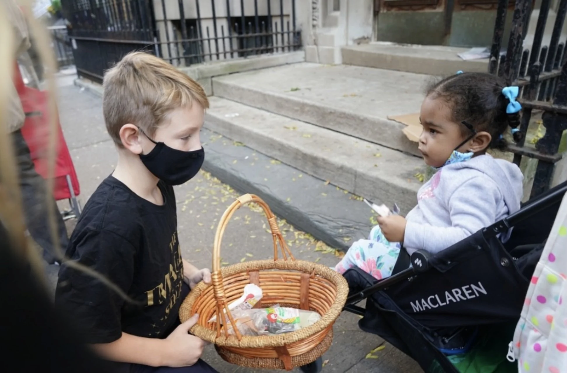  A volunteer gives out candy at a Thanksgiving distribution.