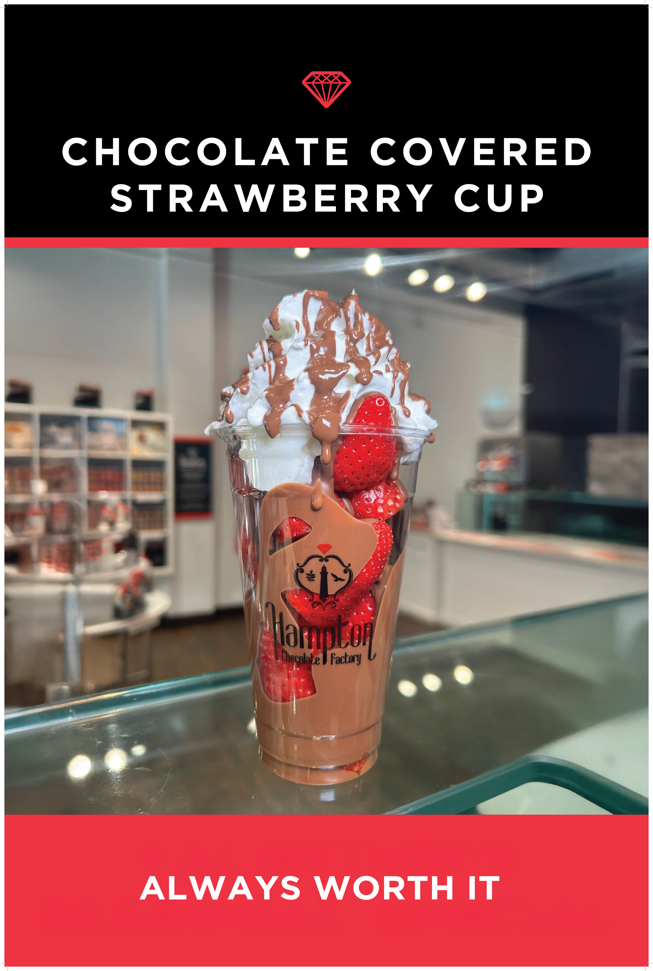 Chocolate covered strawberry cupcake in a clear cup with strawberries and chocolate, on a glass counter at hampton chocolate factory.