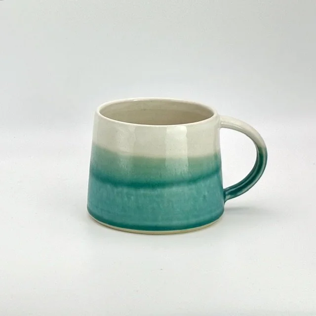Turquoise green and white tall angled mug