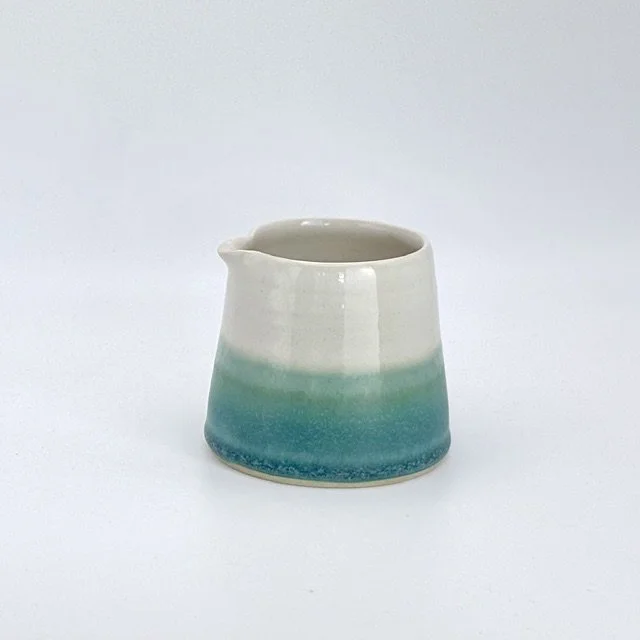 Pourer in turquoise and white