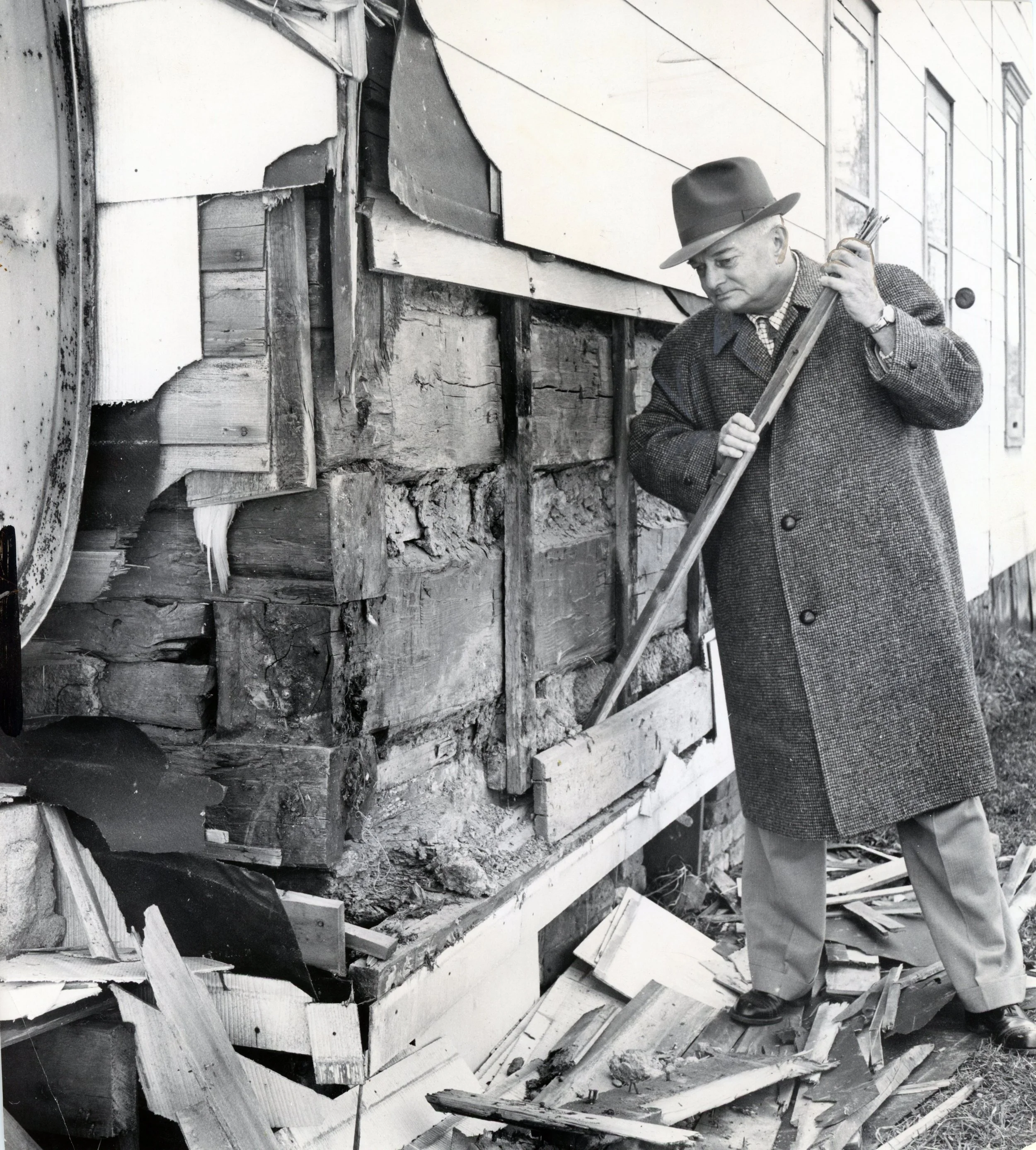 1961_uncovering the siding to reveal a school.jpg