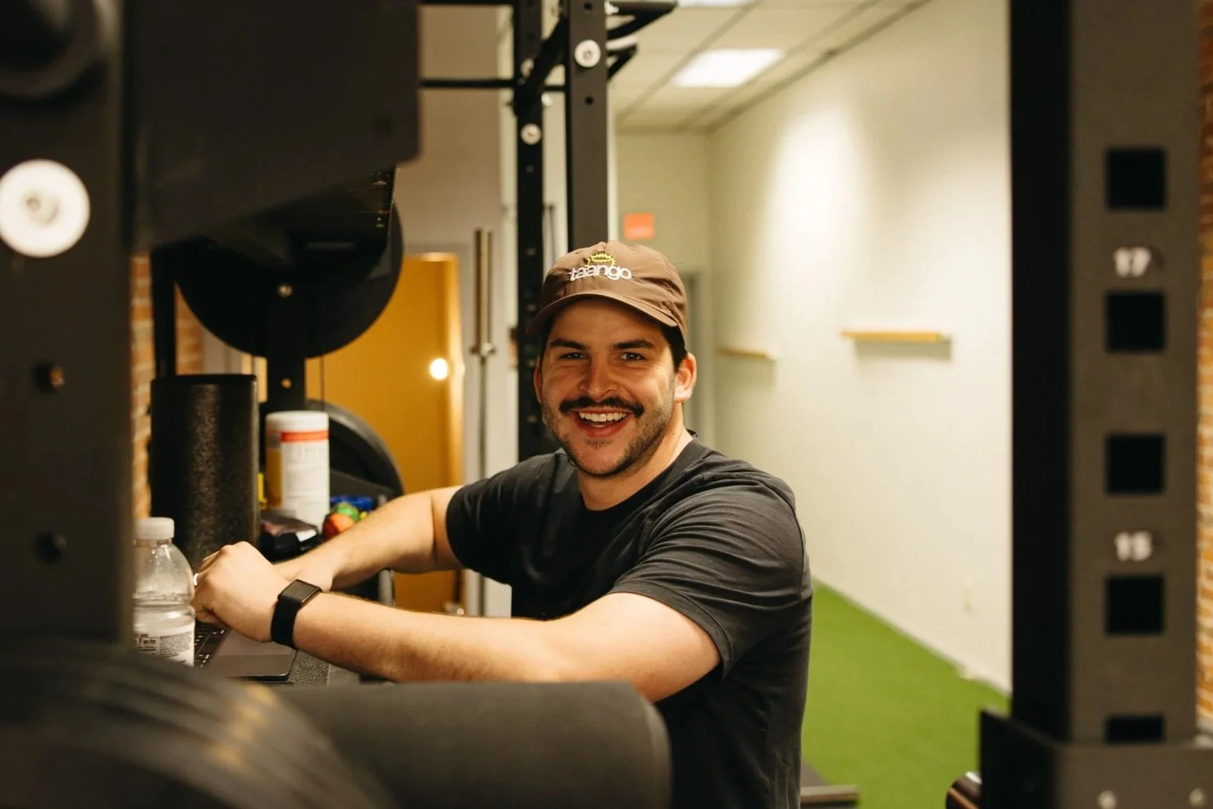Mason Musgrove, the owner of Origin Strength while training clients.