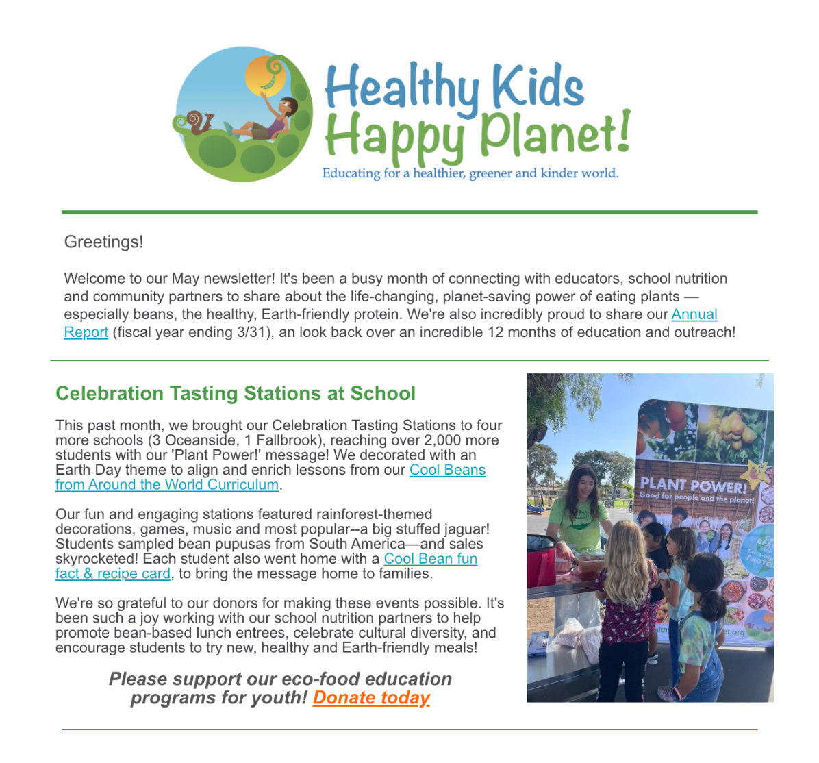 A group of children and a woman at an outdoor plant-themed event with a banner that reads "PLANT POWER!" in front of trees and blue sky.