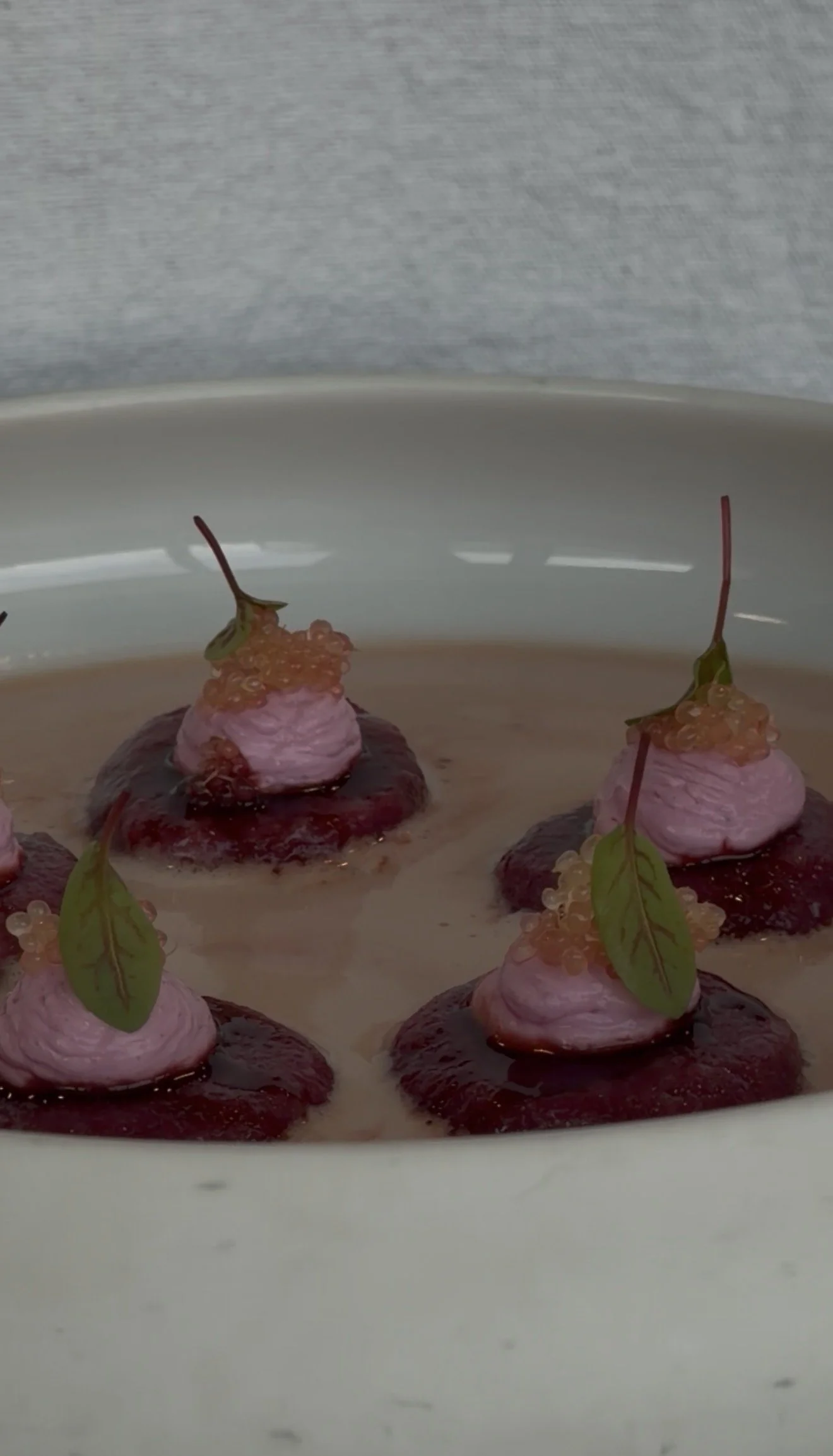 Delicate plated bites with soft textures and bright accents