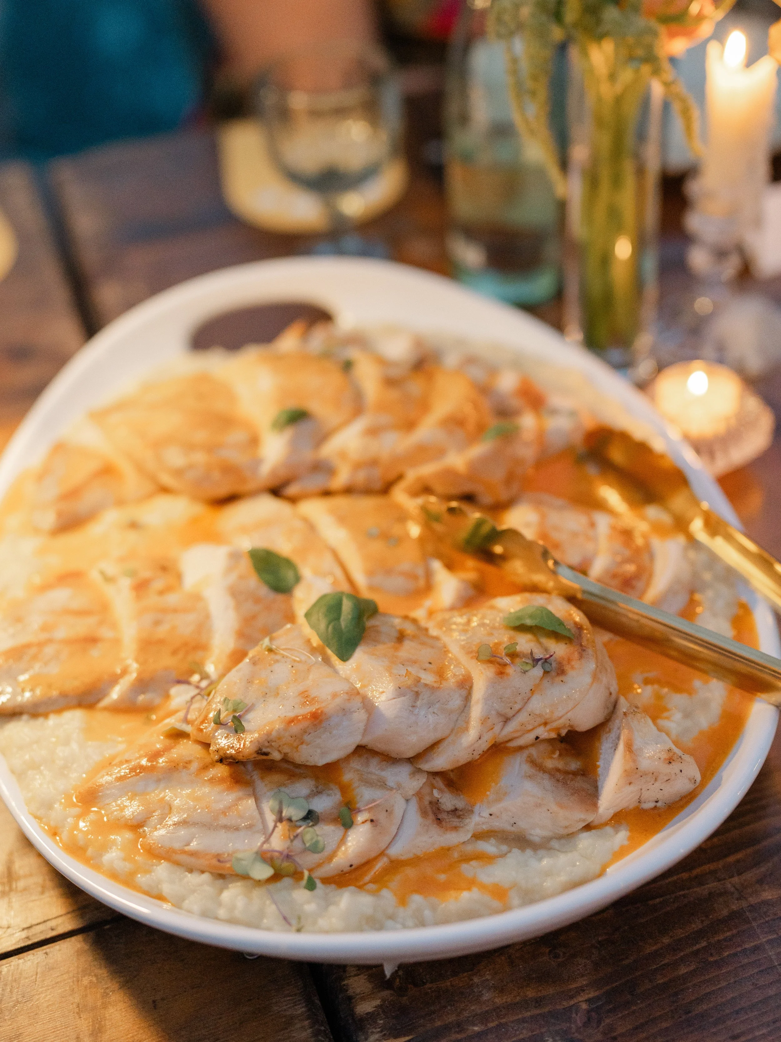 Chicken served family-style with a light sauce