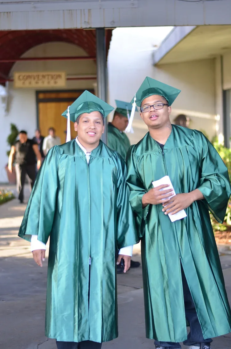 two teen guys on graduation day