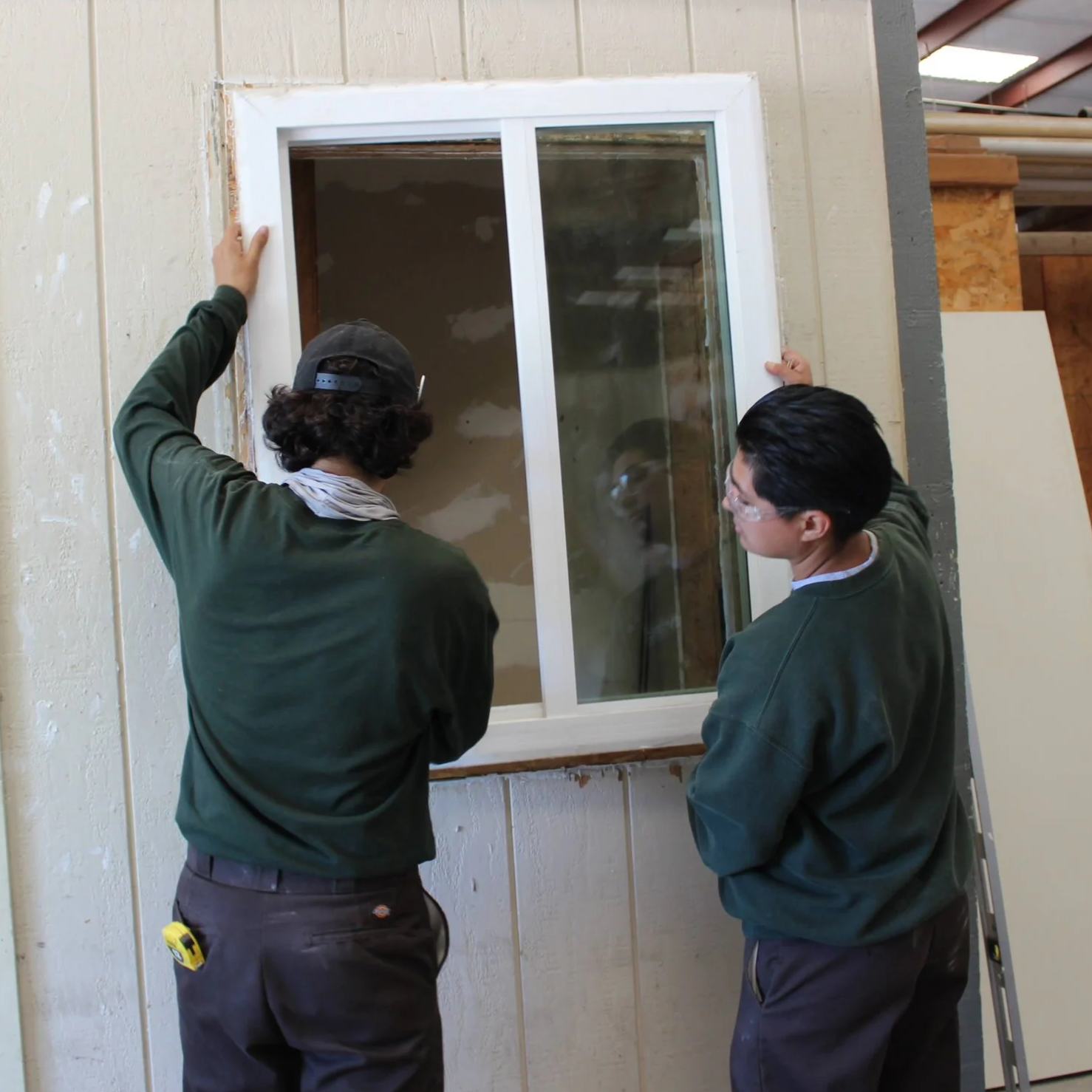 Woman fixing a window