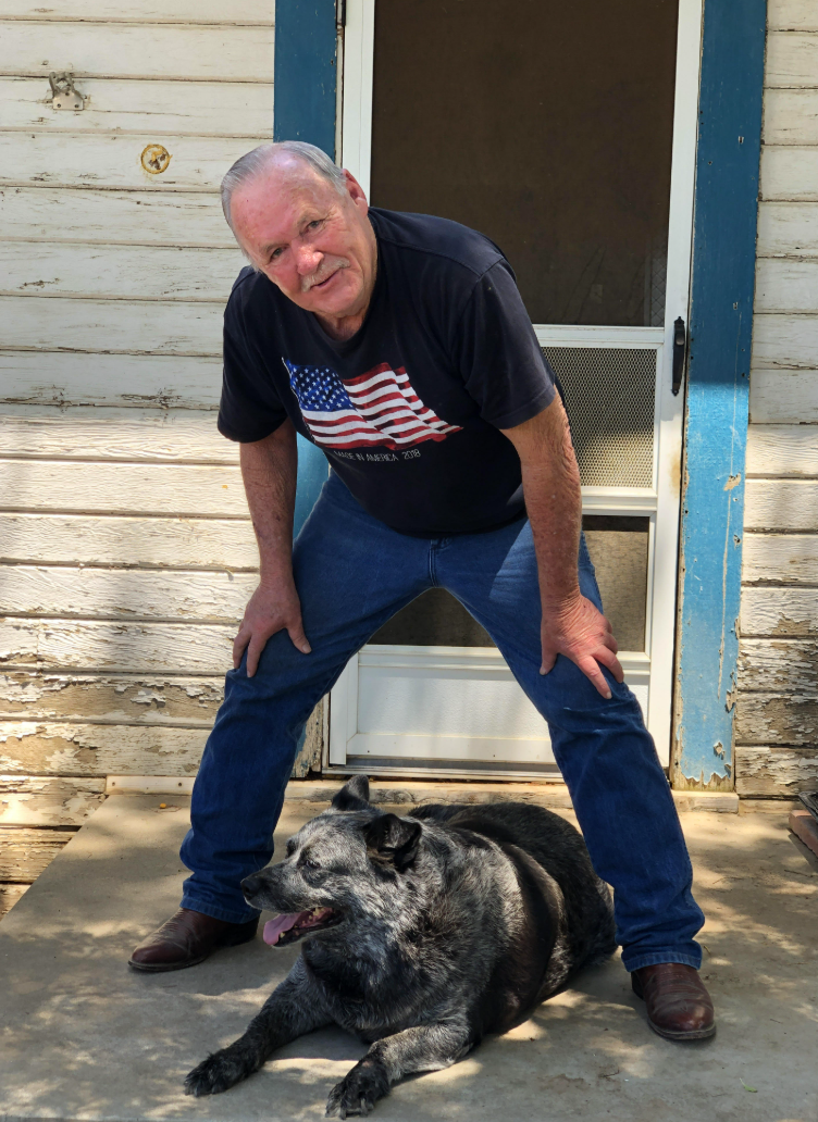 a man posing with his dog