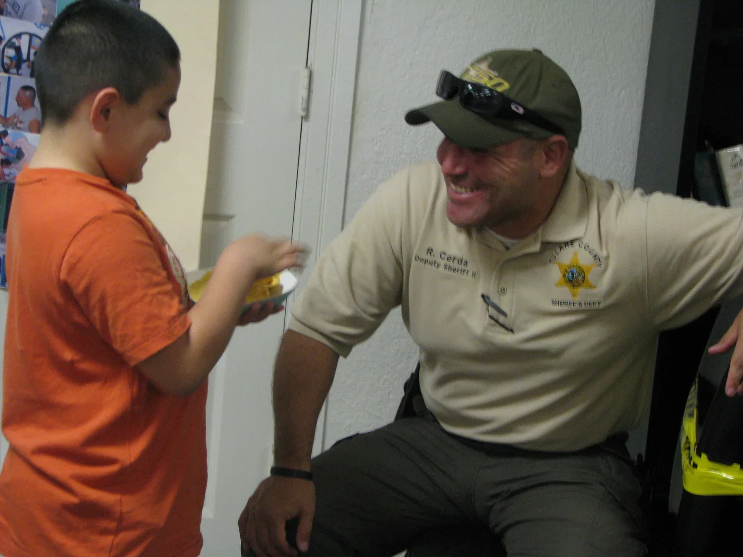 man and a boy smiling at each other
