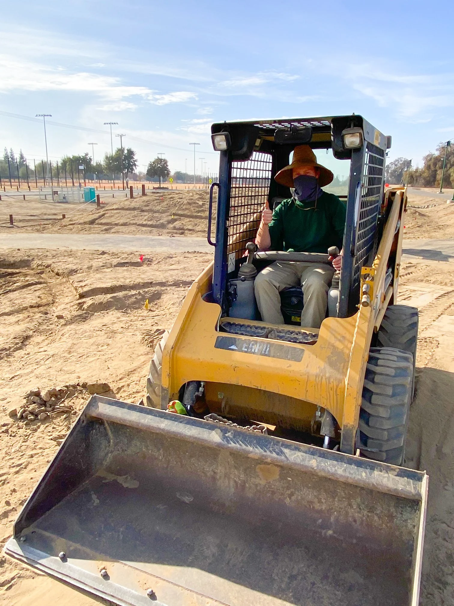 man in a work tractor at a job site