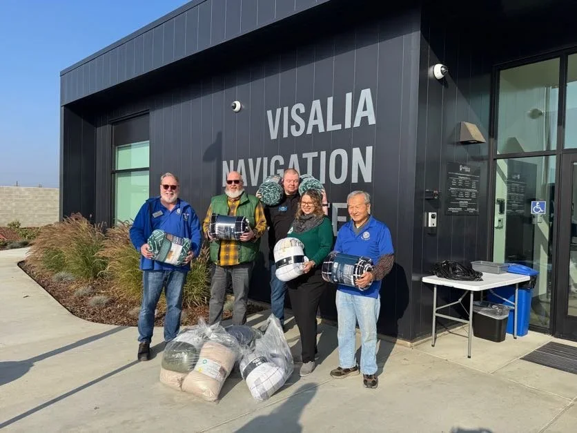 a group of people in front of our navigation center