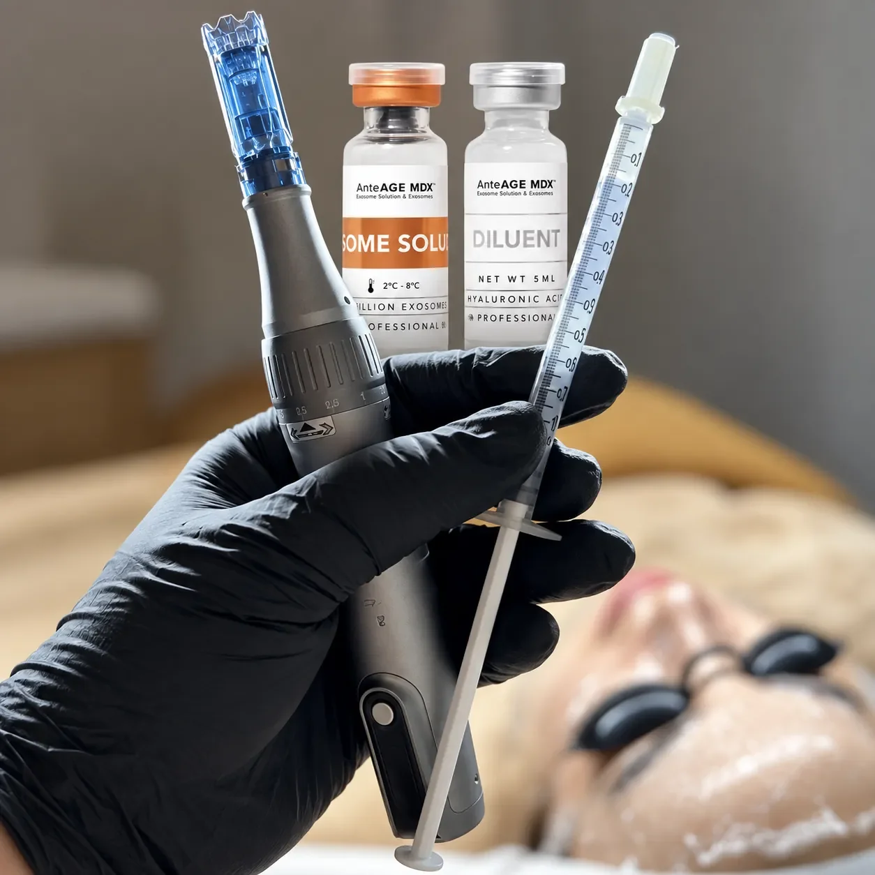 Skincare vials and facial treatment tools beside a client receiving a treatment.