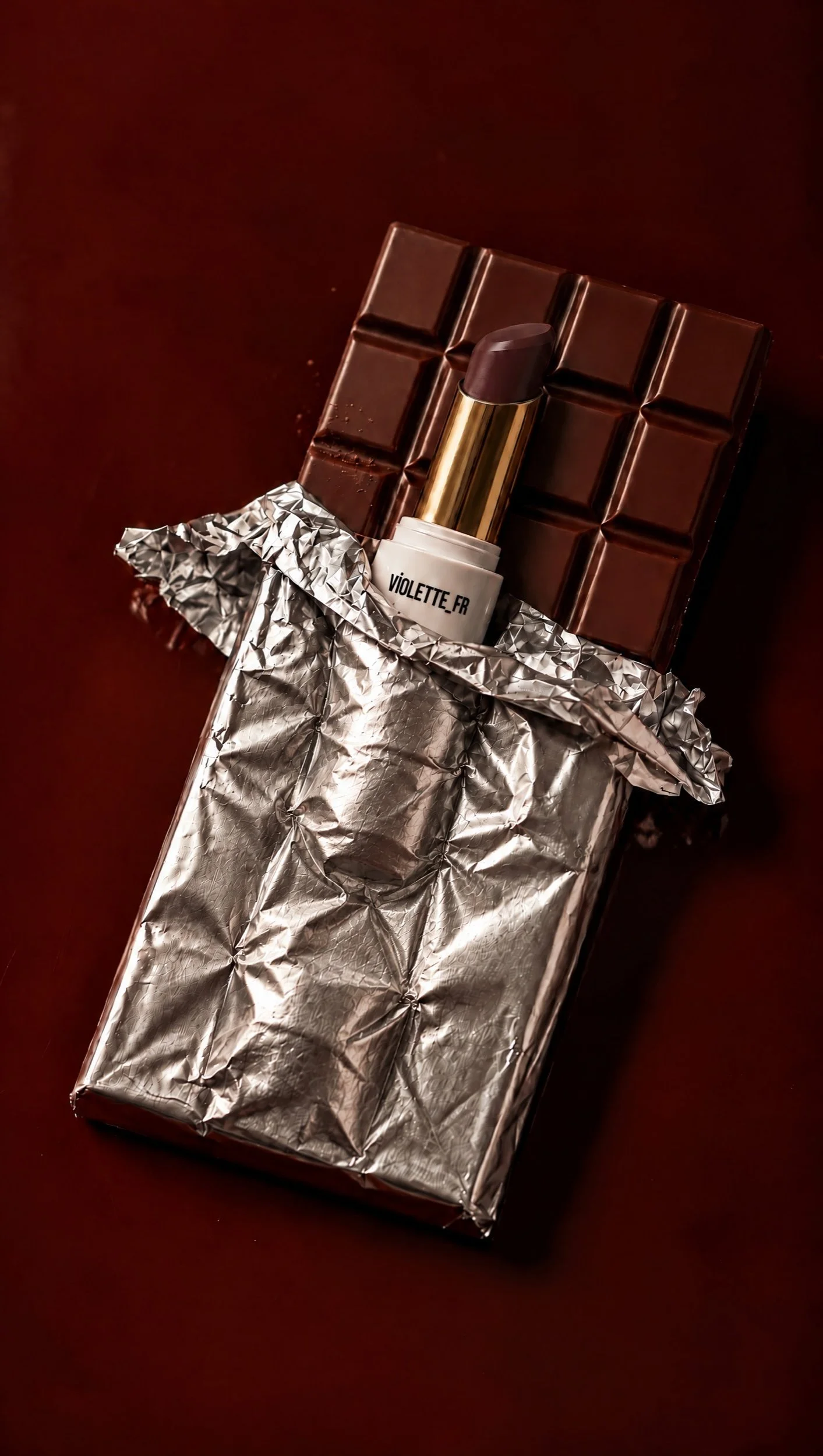Lipstick unwrapped from foil like a chocolate bar