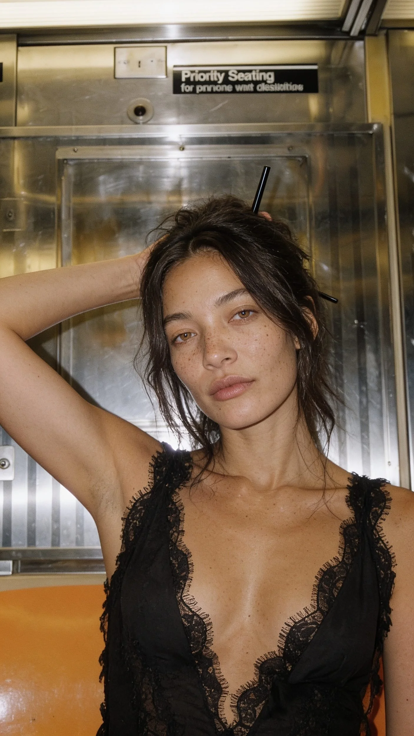 Key frame 2: close portrait of the model on the subway with chopsticks in her hair