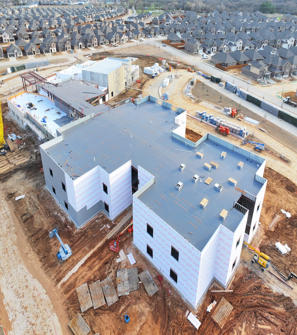 Roofing installation at Pete & Myra West Elementary construction site.