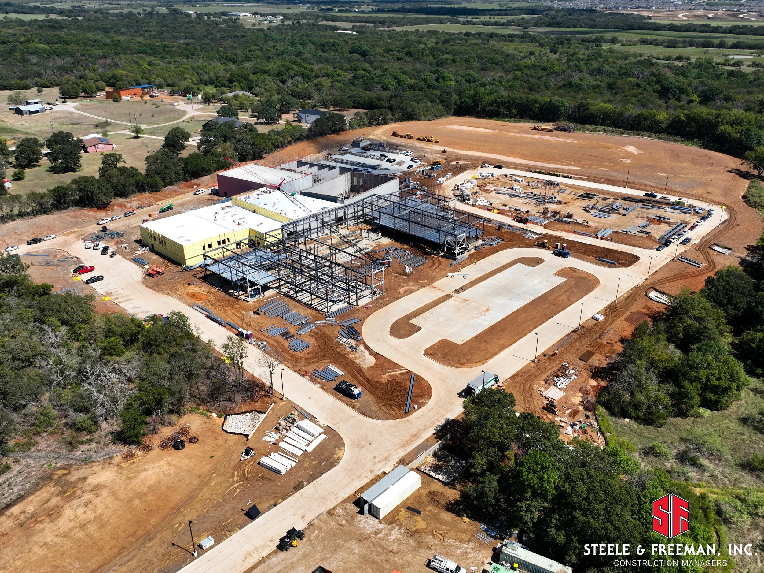 Installation of steel framework at Evalois Owens Middle School construction site.
