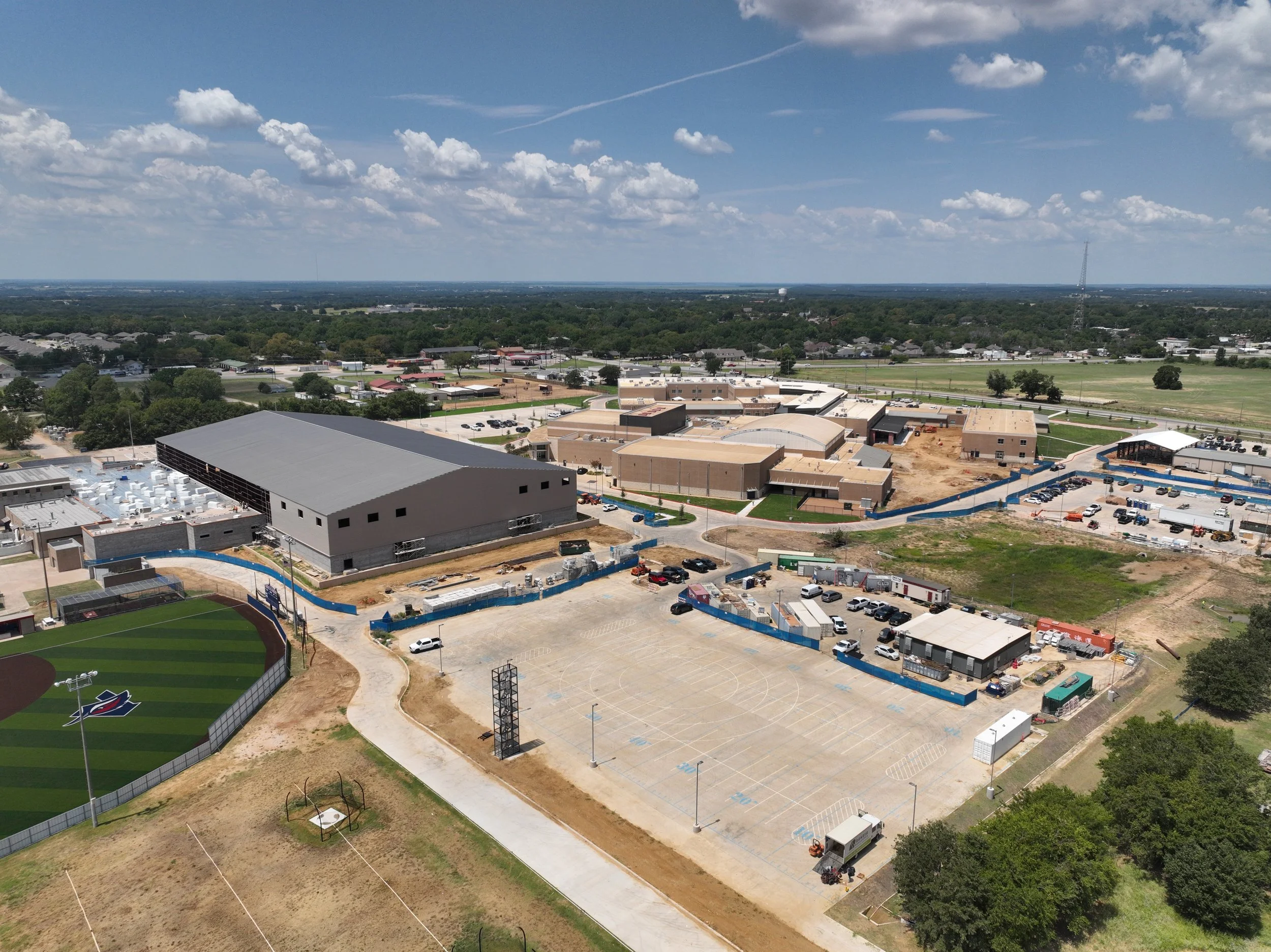 Interior build-out progress inside Aubrey High School field house.