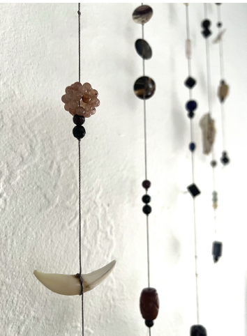 Fear Catcher detail, sticks, stones, beads, and bones, 20” x 22” x 1”, 2023