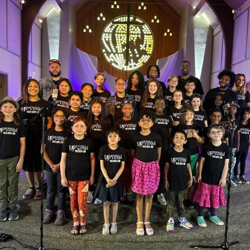A group picture of Lifted! students during a weekly rehearsal in the sanctuary.