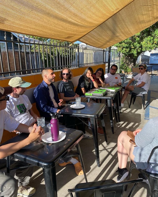 Petrichor students and adult leaders enjoy a meal together after a coffee workshop in Redlands, CA.