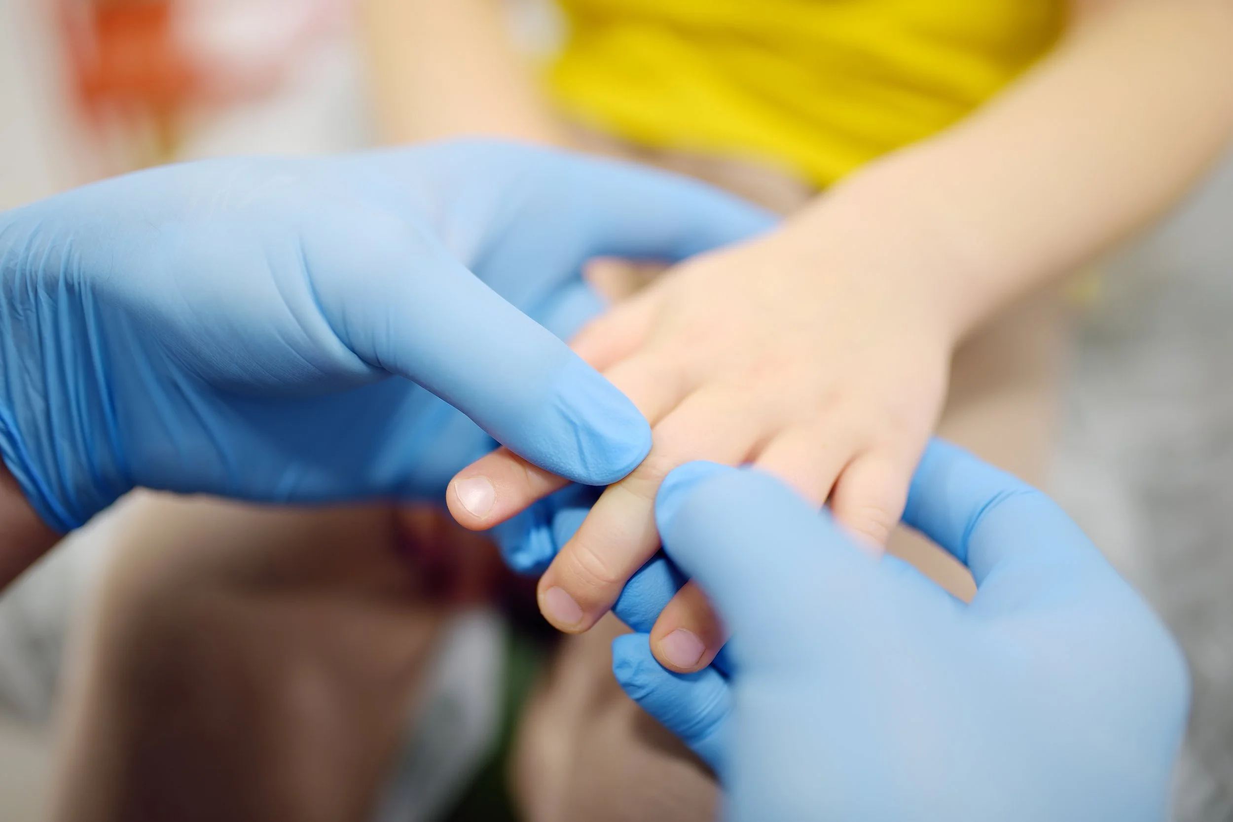 Pediatric dermatologist examining a child’s skin lesion in Madison, CT